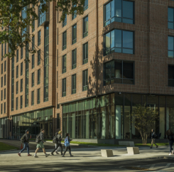 Students passing by the new building
