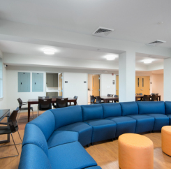 Common lounge area with blue sectional sofa