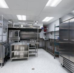 Commercial kitchen with shiny steel appliances