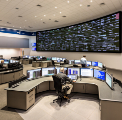 Employees at their desks in the command center
