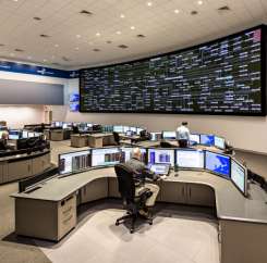 Employees at their desks in the command center