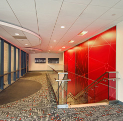 Upstairs facing the stairs and red feature wall