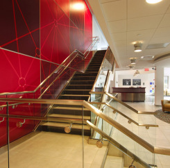 Central staircase with red feature wall