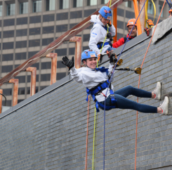 Jillian waiting for Natasha to climb over the edge